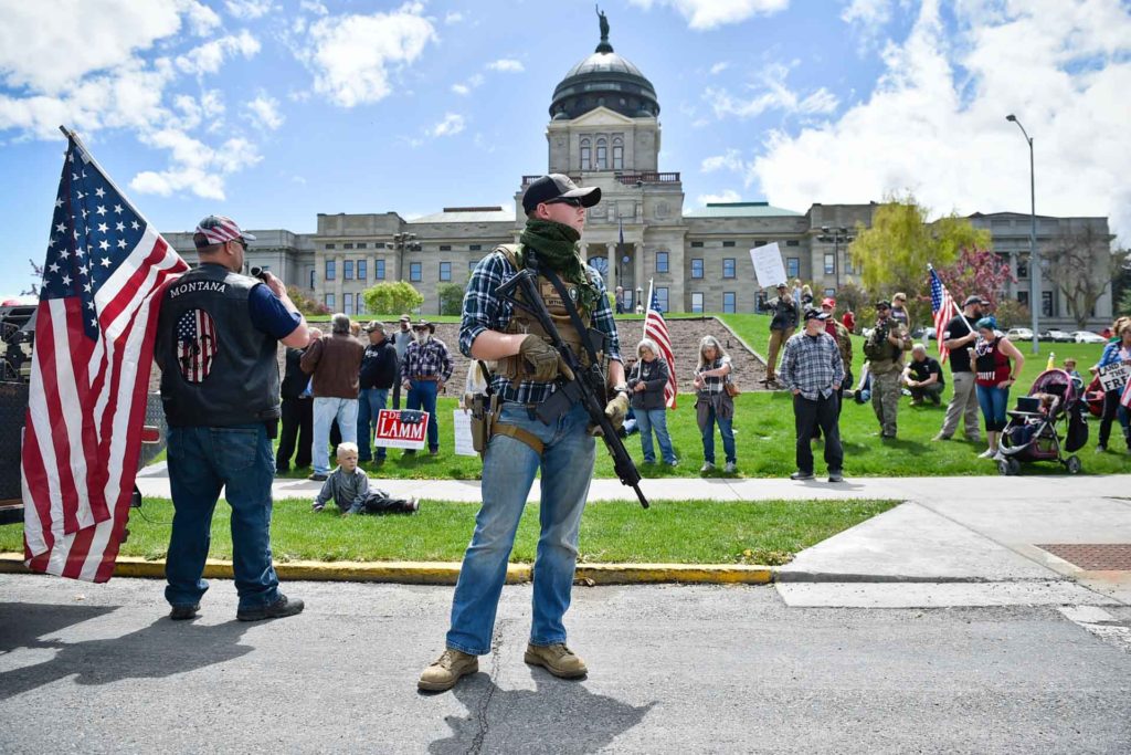 Protesters gather outside the Montana State Capitol in Helena, Montana, criticizing Gov. Steve Bullock’s response to the COVID-19 pandemic. (AP Photo, Thom Bridge)